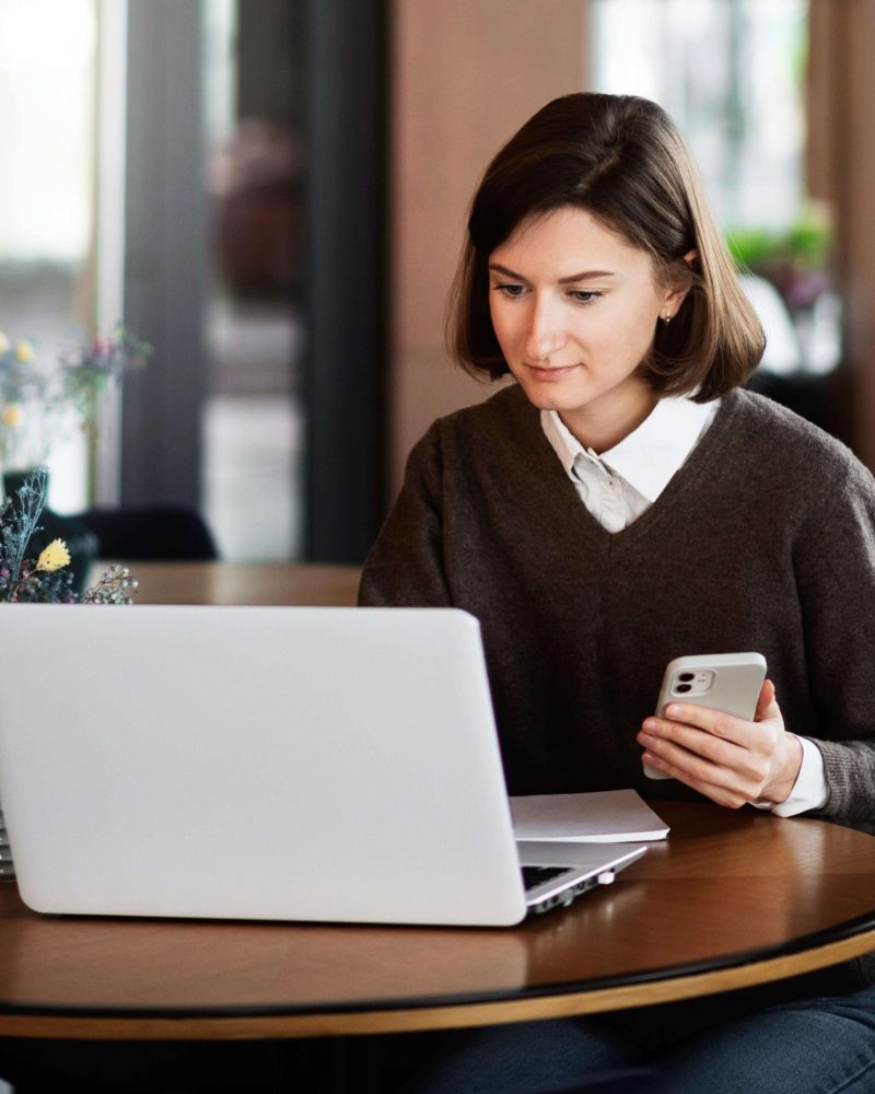 business-woman-using-laptop-table (3) (1)